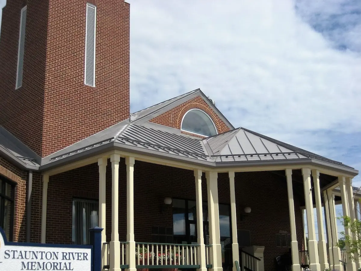 Skilled roofing craftsmen working on a residential roof in Vine City